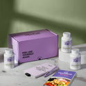 A product bundle display for GleeFull Supplements on a marble surface against a green background. The layout includes a large purple shipping box featuring the slogan 'FEEL LIKE YOURSELF AGAIN.', three white bottles of Meno Belly Night Burn, a purple branded pen, a matching notepad that reads 'REMINDERS WHEN I'M HAVING A MENOPAUSE MOMENT', and a recipe booklet titled 'THE MENOPAUSE Recipes'