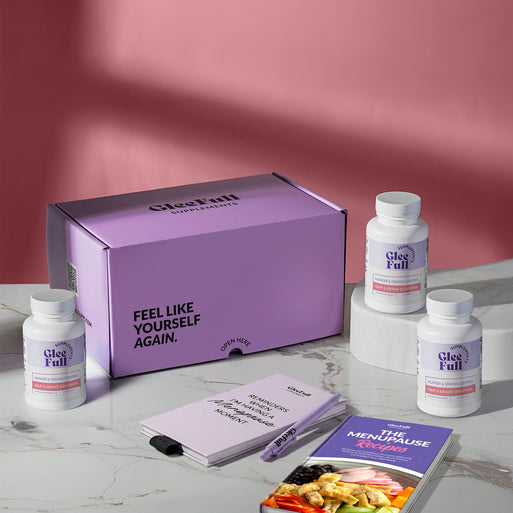 A hand holding a golden supplement capsule against a light gray background. Pink and purple headline text reads 'Natural GLP-1 Alternative, Control Cravings & Burn Fat Steadily.' A purple circular badge reads 'How to Use: Take 2 capsules in the morning or night to control cravings & stress eating.'